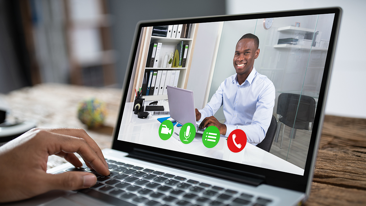 Cropped Image Of Businessman Using Laptop At Desk